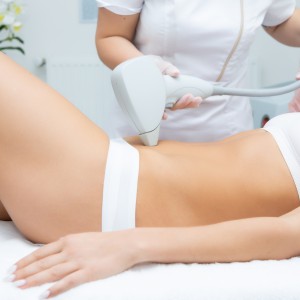 the girl is given laser hair removal. Laser hair removal concept